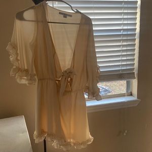 Beautiful cream flowy front keyhole cutout romper. Worn one time!